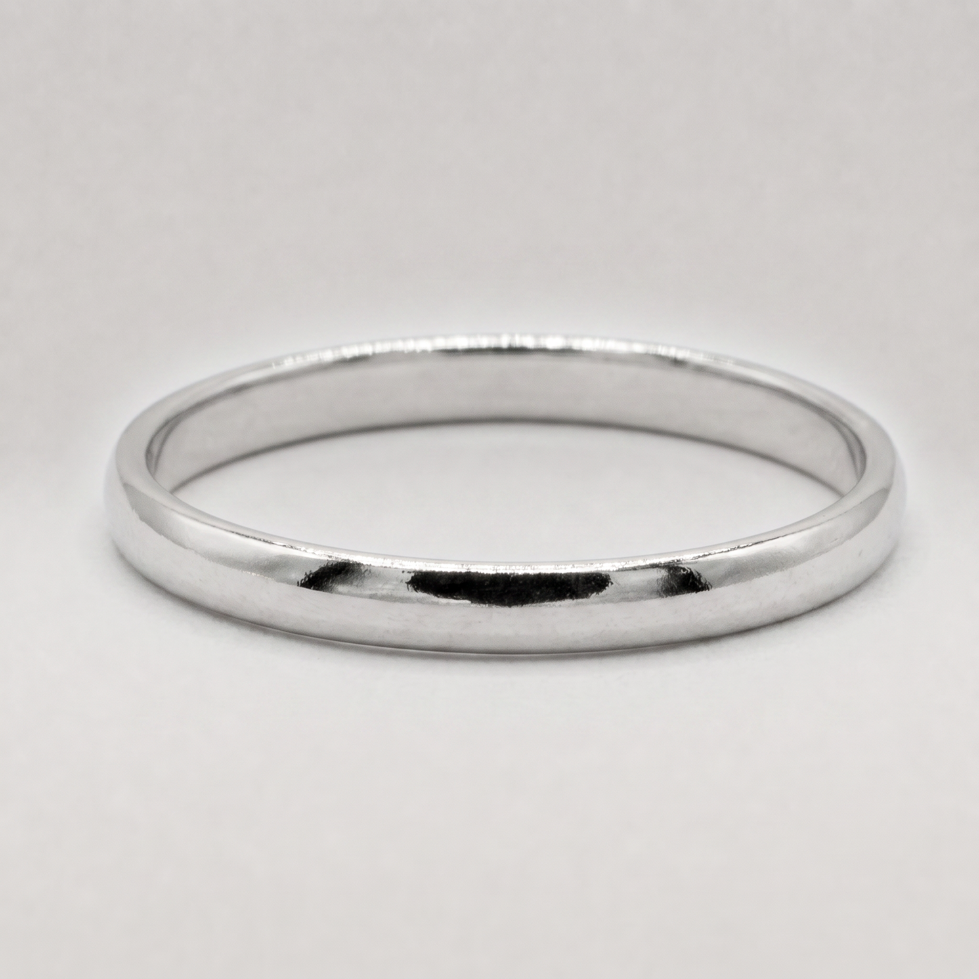 925 sterling silver band ring, 2mm width, on a plain background.